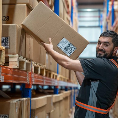 A man holding a cardboard box.